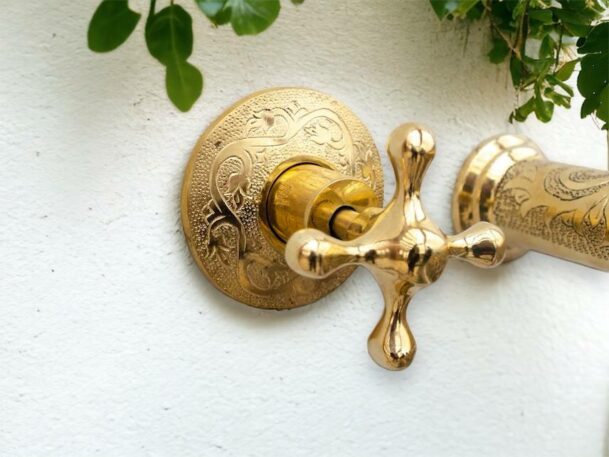 Handcrafted brass wall-mounted basin mixer